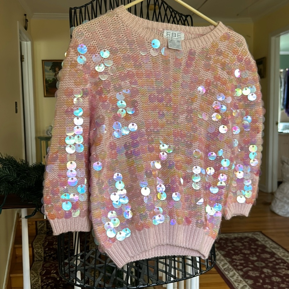 Pink knit, size medium sweater with pretty, shiny dangling disks. Vintage.